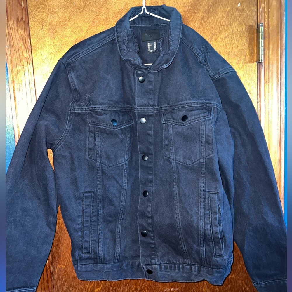 Black denim jacket. Distressed design size extra large